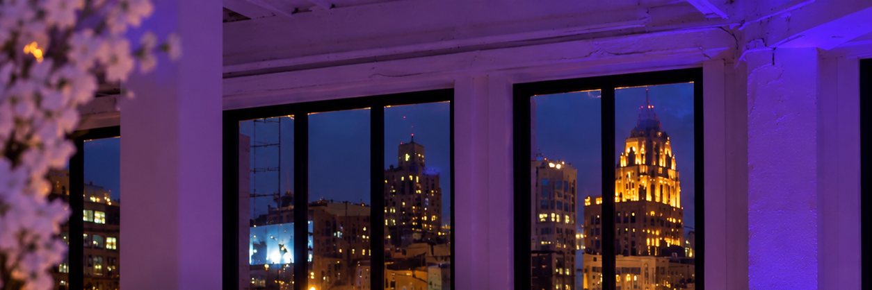 Detroit skyline seen through the loft windows at dusk